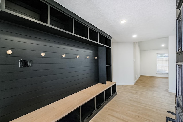 150 Squires Bnd, Stafford, TX 77477 - mudroom with baseboards, light wood-style flooring, recessed lighting, and a textured ceiling