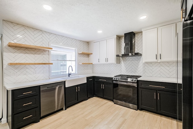 150 Squires Bnd, Stafford, TX 77477 - kitchen featuring open shelves, appliances with stainless steel finishes, wall chimney exhaust hood, dark cabinets, and a textured ceiling