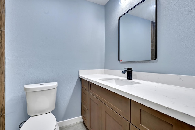 627 Edgebrook Dr, Houston, TX 77034 - bathroom with toilet, vanity, and baseboards