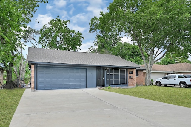 627 Edgebrook Dr, Houston, TX 77034 - ranch-style house featuring a garage, brick siding, a front yard, concrete driveway, and roof with shingles