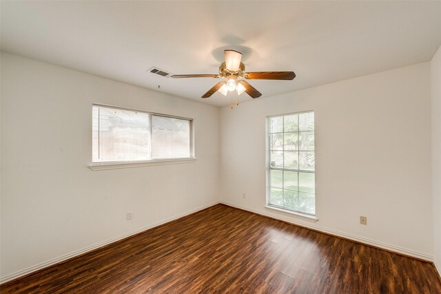 6310 Ash Oak Dr, Houston, TX 77091 - unfurnished room with dark wood-style flooring, baseboards, and a ceiling fan
