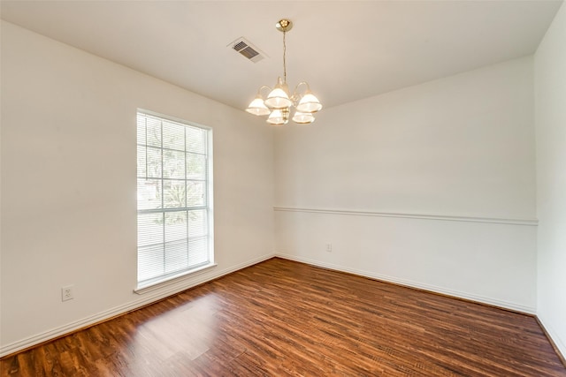 6310 Ash Oak Dr, Houston, TX 77091 - empty room with a chandelier, wood finished floors, and baseboards
