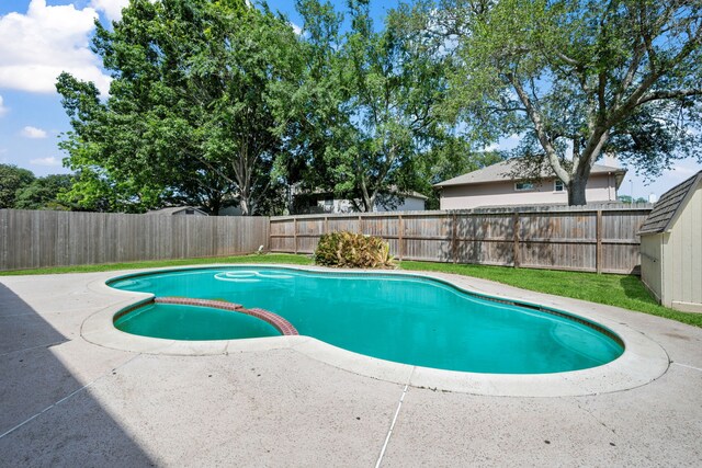 4309 Kingfish Dr, Seabrook, TX 77586 - view of swimming pool with a pool with connected hot tub, a patio area, and a fenced backyard