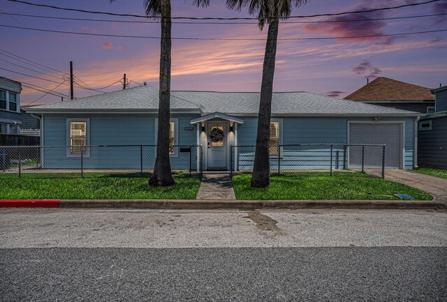 1014 11th St, Galveston, TX 77550 - ranch-style house with a garage, concrete driveway, a fenced front yard, and a shingled roof