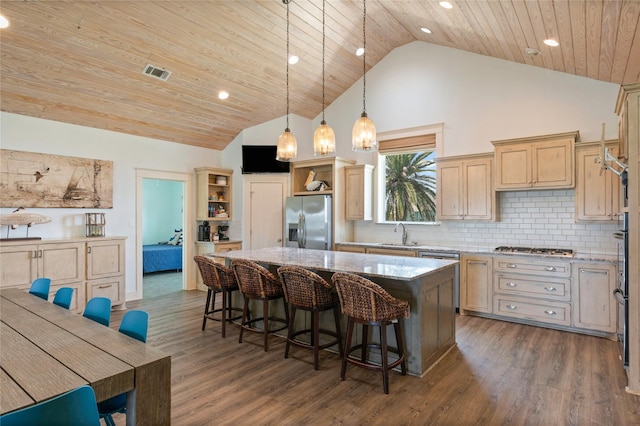 2585 Tide Dr, Crystal Beach, TX 77650 - kitchen featuring appliances with stainless steel finishes, open shelves, wooden ceiling, a kitchen island, and high vaulted ceiling