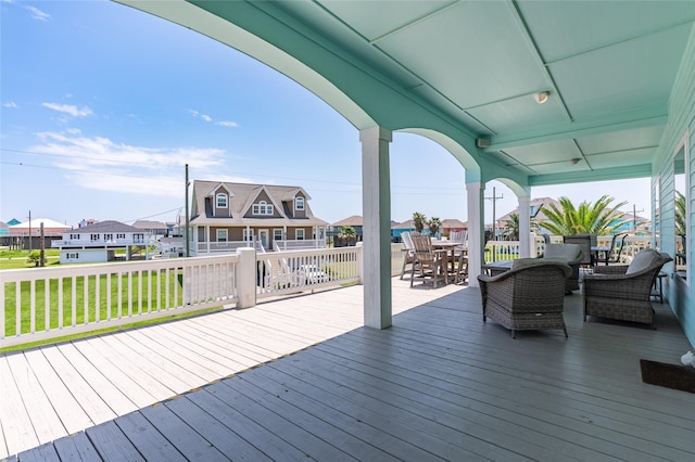 2585 Tide Dr, Crystal Beach, TX 77650 - wooden terrace with outdoor dining space and a residential view