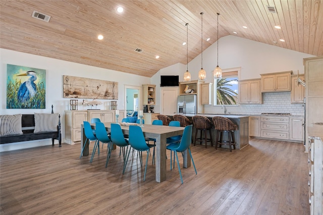 2585 Tide Dr, Crystal Beach, TX 77650 - dining area featuring wood ceiling, high vaulted ceiling, light wood-style floors, and recessed lighting