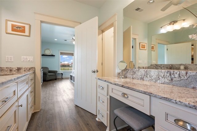 2585 Tide Dr, Crystal Beach, TX 77650 - ensuite bathroom with a ceiling fan, wood-type flooring, vanity, and recessed lighting