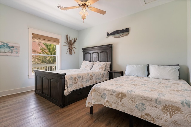 2585 Tide Dr, Crystal Beach, TX 77650 - bedroom featuring wood finished floors, baseboards, and ceiling fan
