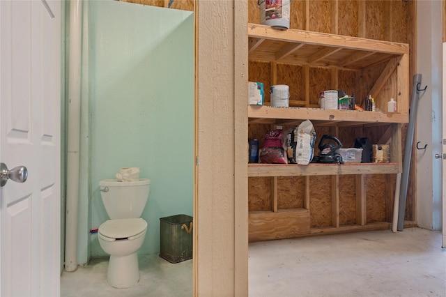 2585 Tide Dr, Crystal Beach, TX 77650 - bathroom featuring toilet and unfinished concrete floors