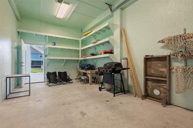 2585 Tide Dr, Crystal Beach, TX 77650 - interior space featuring concrete floors, access to outside, and a textured wall