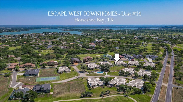 1406 Broken Hls Unit 14, Horseshoe Bay, TX 78657 - aerial view of property and surrounding area featuring a nearby body of water and nearby suburban area