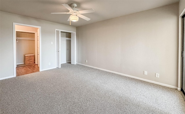 1406 Broken Hls Unit 14, Horseshoe Bay, TX 78657 - unfurnished bedroom with carpet floors, baseboards, and a ceiling fan
