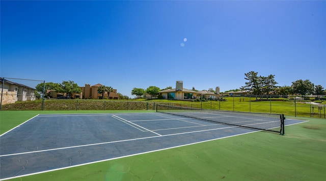 1406 Broken Hls Unit 14, Horseshoe Bay, TX 78657 - view of tennis court featuring community basketball court