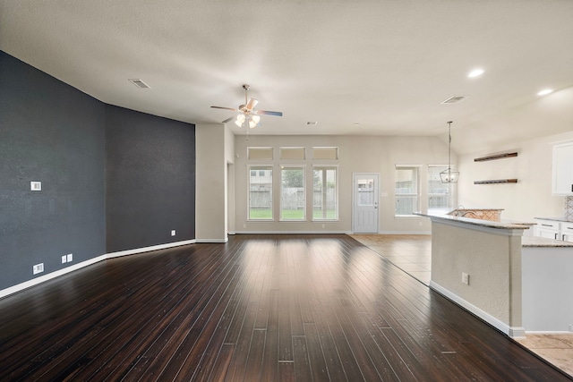 19119 Cardinal Grove Ct, Cypress, TX 77429 - unfurnished living room featuring a ceiling fan and dark wood-type flooring