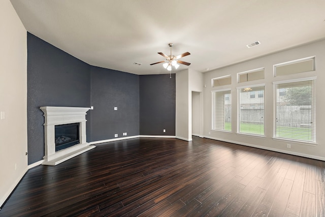 19119 Cardinal Grove Ct, Cypress, TX 77429 - unfurnished living room with a ceiling fan, dark wood-style flooring, and a glass covered fireplace