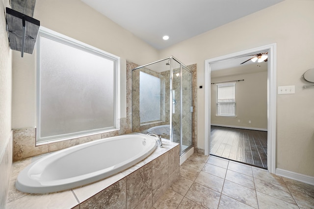 19119 Cardinal Grove Ct, Cypress, TX 77429 - full bathroom featuring a bath, a shower stall, tile patterned floors, and a ceiling fan