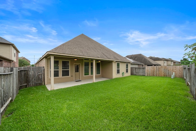 19119 Cardinal Grove Ct, Cypress, TX 77429 - back of house with a shingled roof, a patio area, and a fenced backyard