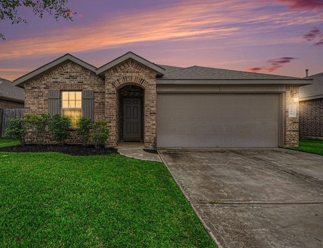 607 Harvest Bluff Dr, Rosharon, TX 77583 - view of front of property featuring concrete driveway, brick siding, and a front lawn