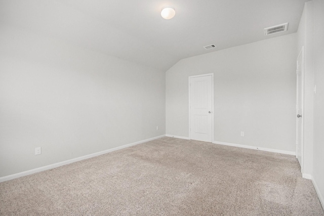 607 Harvest Bluff Dr, Rosharon, TX 77583 - unfurnished room with light carpet, baseboards, and vaulted ceiling