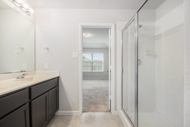 607 Harvest Bluff Dr, Rosharon, TX 77583 - bathroom with double vanity, a stall shower, and tile patterned floors
