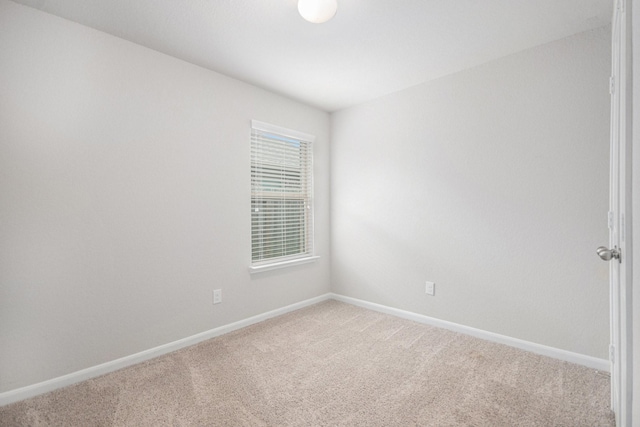 607 Harvest Bluff Dr, Rosharon, TX 77583 - spare room featuring light carpet and baseboards
