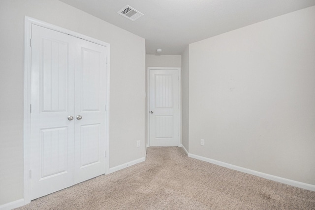607 Harvest Bluff Dr, Rosharon, TX 77583 - unfurnished bedroom featuring light carpet, baseboards, and a closet