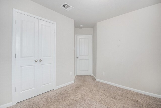 607 Harvest Bluff Dr, Rosharon, TX 77583 - unfurnished bedroom with light colored carpet and a closet