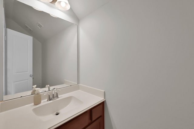 16819 Apple River Dr, Cypress, TX 77433 - bathroom featuring lofted ceiling and vanity