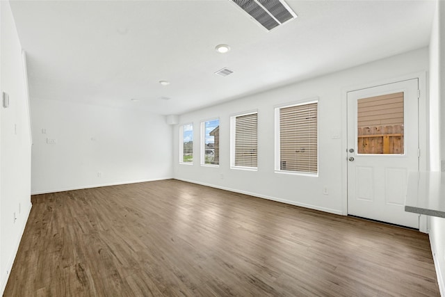 24027 Wandering Brook Dr, Hockley, TX 77447 - empty room featuring wood finished floors and baseboards