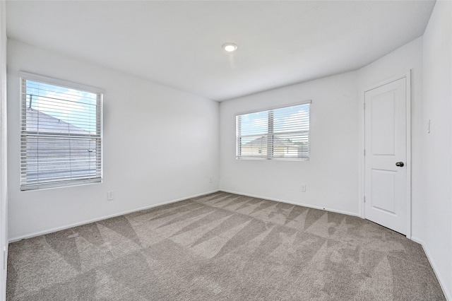 24027 Wandering Brook Dr, Hockley, TX 77447 - unfurnished room featuring carpet floors and baseboards
