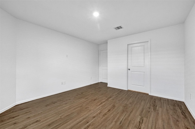 24027 Wandering Brook Dr, Hockley, TX 77447 - unfurnished bedroom featuring wood finished floors and baseboards