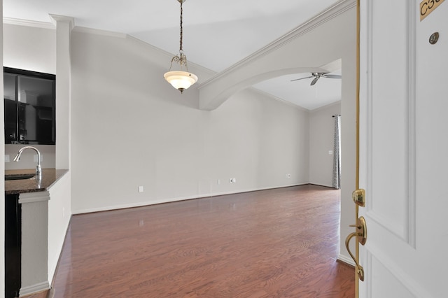 2100 Welch St Unit C309, Houston, TX 77019 - interior space with ceiling fan, dark wood-type flooring, ornamental molding, and arched walkways