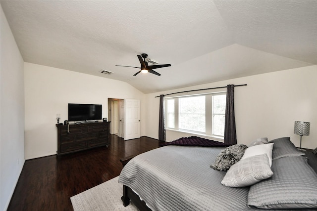 9107 S Ferndale Place Dr, Houston, TX 77064 - bedroom featuring vaulted ceiling, wood finished floors, ceiling fan, and a textured ceiling