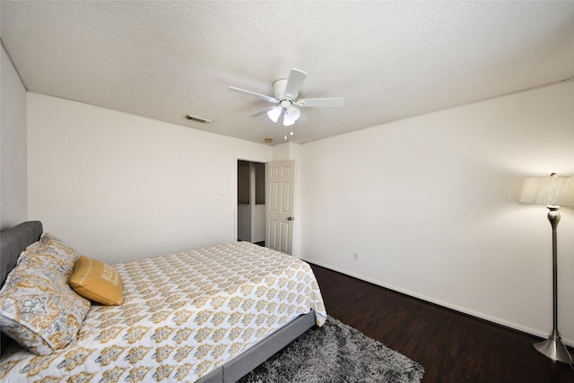 9107 S Ferndale Place Dr, Houston, TX 77064 - bedroom featuring dark wood finished floors and a ceiling fan