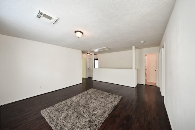 9107 S Ferndale Place Dr, Houston, TX 77064 - empty room featuring dark wood-style floors and a textured ceiling