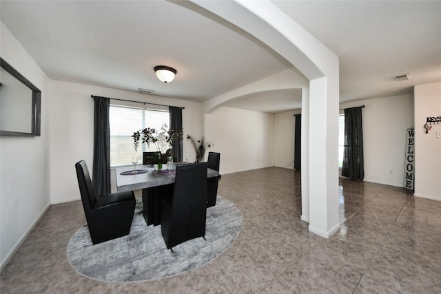 9107 S Ferndale Place Dr, Houston, TX 77064 - dining space featuring arched walkways and baseboards