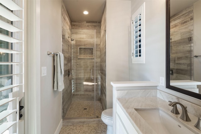 4810 R O Dr, Spicewood, TX 78669 - full bathroom featuring toilet, a shower stall, vanity, tile patterned floors, and recessed lighting