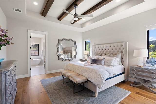 4810 R O Dr, Spicewood, TX 78669 - bedroom with multiple windows, wood finished floors, baseboards, beamed ceiling, and recessed lighting