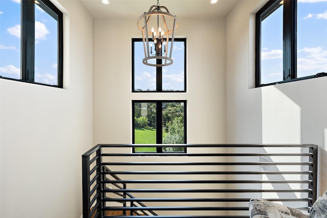 4810 R O Dr, Spicewood, TX 78669 - staircase with a chandelier, recessed lighting, and a towering ceiling