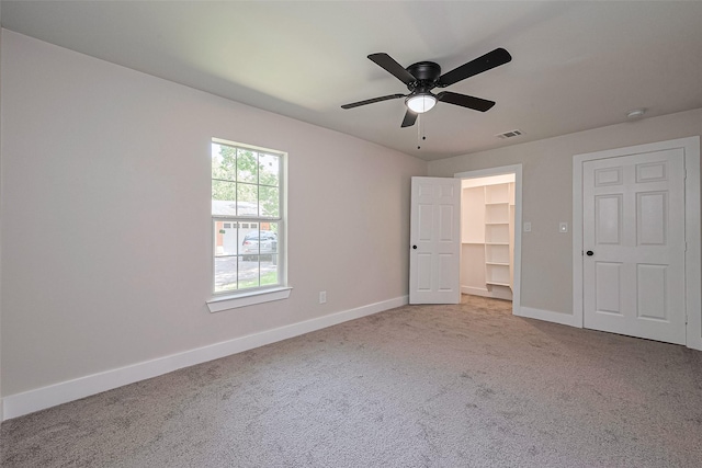 5032 Briscoe St, Houston, TX 77033 - unfurnished bedroom featuring baseboards, carpet, a spacious closet, a ceiling fan, and a closet