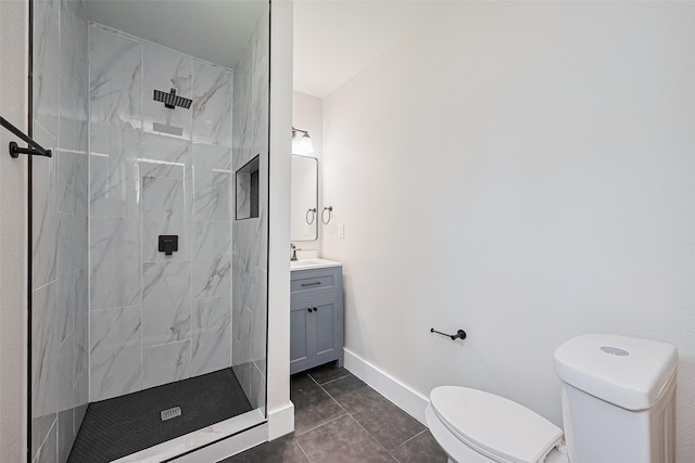 5032 Briscoe St, Houston, TX 77033 - bathroom with toilet, vanity, a marble finish shower, baseboards, and tile patterned flooring