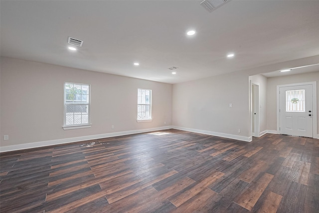 5032 Briscoe St, Houston, TX 77033 - empty room with dark wood-style floors, recessed lighting, and baseboards