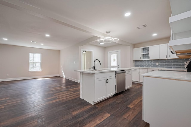 5032 Briscoe St, Houston, TX 77033 - kitchen featuring open shelves, a sink, stainless steel dishwasher, an island with sink, and tasteful backsplash