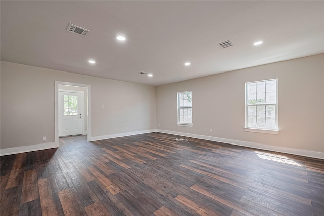 5032 Briscoe St, Houston, TX 77033 - unfurnished room with dark wood-type flooring, baseboards, and recessed lighting