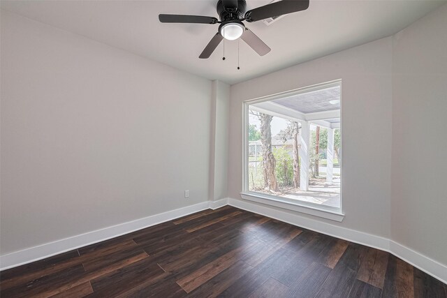 5032 Briscoe St, Houston, TX 77033 - spare room featuring baseboards, dark wood-style floors, and ceiling fan