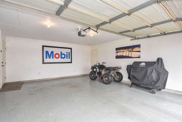 466 Emanuel Rd, Goodrich, TX 77335 - garage with a garage door opener and baseboards