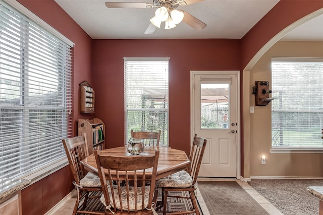 3626 Avalon Spring Ln, Spring, TX 77386 - dining space with ceiling fan, arched walkways, and baseboards