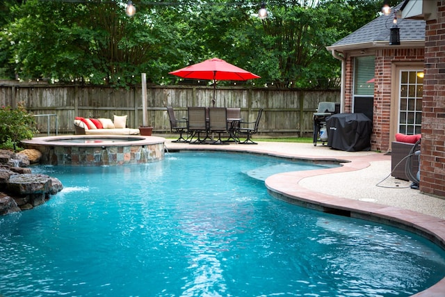 13926 Wessex Park Dr, Cypress, TX 77429 - view of swimming pool featuring area for grilling, a pool with connected hot tub, and a patio