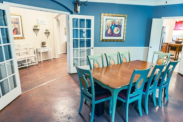 13926 Wessex Park Dr, Cypress, TX 77429 - dining room with arched walkways, concrete floors, and french doors